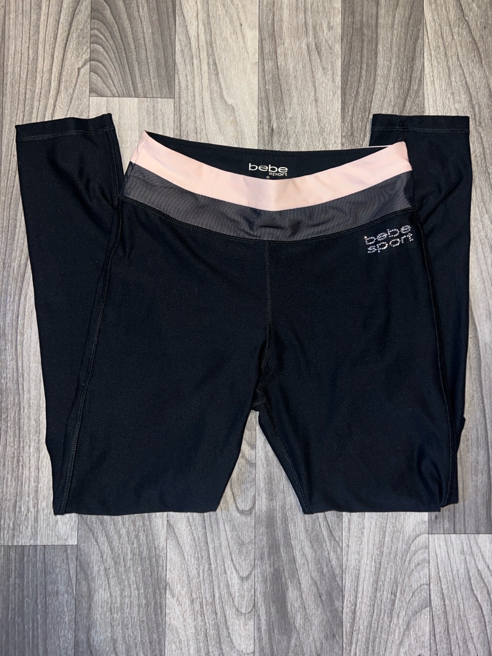 Bebe Sport black leggings with pink waistband and open knee